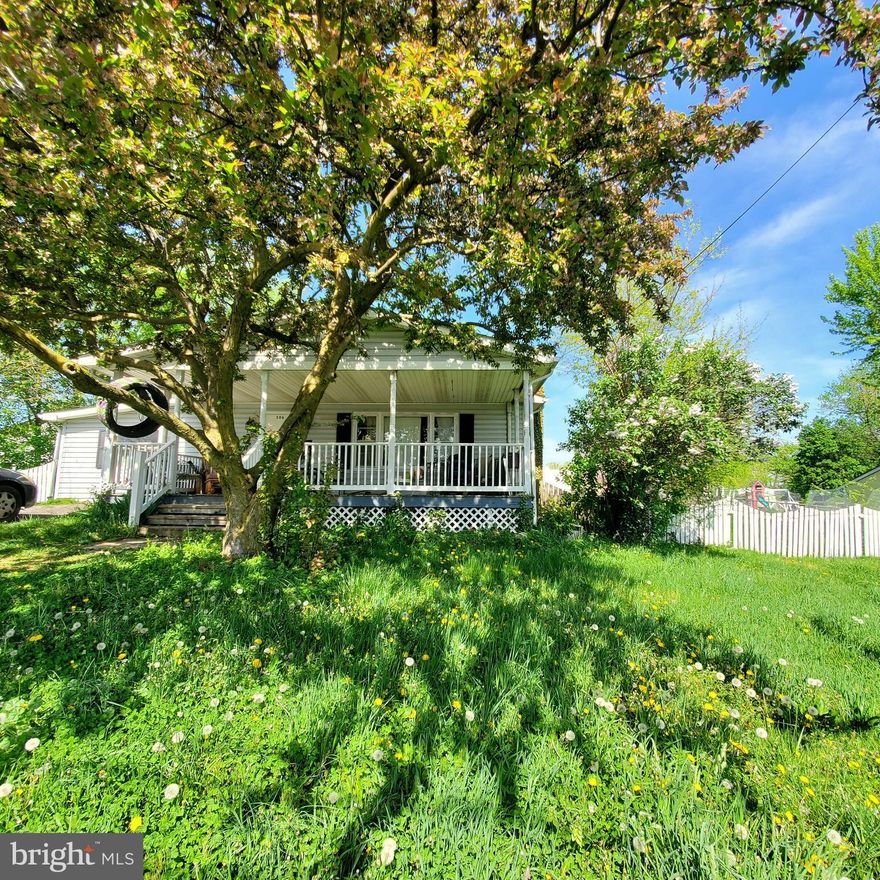 Nice house, needs a little TLC but can live in while you update.  Home is on two lots, large back yard that is fenced.  Off street parking and large covered front porch.  Has three large bedrooms and a full bath.  Kitchen and dining room are attached and has plenty of room for nice dining area.  Large living room with wood burning fireplace.
