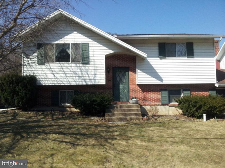 This charming bi-level home is situated on an oversized corner lot and is adjacent to natural areas. Spacious upper level features a large living room with a picture window showcasing seasonal scenic views. Sunny eat-in kitchen includes updated appliances, ceramic tile, and deck access for outdoor living. The 2 upper level bedrooms have marble window sashes, ample closet space, and hardwood floors. Lower level boasts an openly designed family room with a fireplace. Additional private bedroom with half bath is also located on the lower level. Extra-large laundry room includes washer and dryer. Mailing Address Continued: Middleport Amp: 200