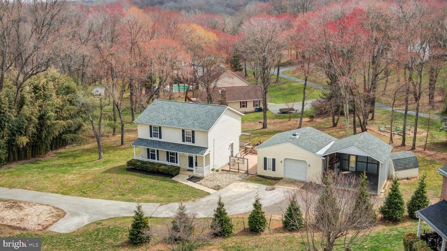 Welcome to this beautifully maintained 3-bedroom, 2.5-bathroom home, nestled on a serene 1.06-acre lot in the heart of Sykesville. Ideally situated less than 2 miles from Liberty High School, this home offers convenient access to local shops, restaurants, and everyday amenities while maintaining a peaceful, private setting.

Step inside to discover warm and inviting living spaces. The heart of the home is the stunning kitchen, complete with sleek stainless steel appliances, gorgeous granite countertops, and ample cabinet space—perfect for any home chef. The dining room features sliding doors that open to a spacious open deck, providing an ideal setting for relaxing or entertaining while taking in the tranquil surroundings.

Upstairs, the expansive primary suite boasts an ensuite bath and a generous walk-in closet, offering plenty of storage and organization options. Two additional well-sized bedrooms and a full bathroom complete the upper level, providing comfortable accommodations for family, guests, or a home office.

The home also features a partly finished basement, offering flexible space that can be used as a recreation room, home gym, or additional storage, with the potential for further customization to suit your needs.

For those who appreciate extra parking and workspace, the detached garage and carport offer ample room, with the potential for lift installation—perfect for car enthusiasts or hobbyists.

Outside, the expansive yard presents endless possibilities for outdoor activities, gardening, or simply enjoying the beauty of nature. This property offers the perfect blend of comfort, space, and convenience.

Don’t miss the opportunity to make this wonderful home yours—schedule your showing today!