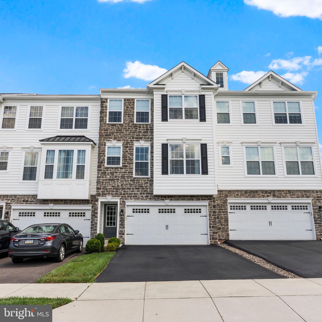 Welcome to 337 Flintrock Ct, Collegeville, located in the highly sought-after Methacton School District! This beautifully upgraded 3-bedroom, 2.5-bath home features a bright and open floor plan filled with abundant natural light, oversized windows, and elegant engineered hardwood flooring. The stunning kitchen features quartz countertops, stainless steel appliances, a gorgeous oversized island, a farmhouse sink, tons of cabinetry, and an integrated audio system, perfect for entertaining or relaxing. The spacious sunroom with exposed wood beams leads to a large deck ideal for outdoor gatherings. The living area is enhanced by wainscoting, decorative wall panels, recessed lighting, and a cozy gas fireplace. The fully finished walk-out basement includes two large walk-in closets, providing additional living space and storage. Upstairs, the primary suite is a private retreat with a gorgeous vaulted wood ceiling, a custom-organized walk-in closet, and a luxurious en-suite bath. A two-car garage, convenient access to restaurants, shopping, dining, and major roadways complete the package. Nothing left to do but unpack your bags! Open House on Saturday, August 2 from 12pm to 2pm—don’t miss your chance to tour this exceptional home!