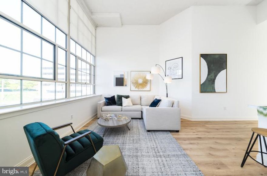 Now offering one month free on a 13 month lease, with a lease start date by 6/1/25!   Enjoy living in this former tuxedo warehouse which has been transformed into fabulous loft style apartments! 2121 Market Street Apartments offers stunning city views!  Located in the Rittenhouse Square neighborhood, the spacious apartments feature super high ceilings with expansive 14-foot windows, hardwood floors, open floor-plans and amazing natural light.  The kitchens are fully equipped and include a breakfast bar. Amenities include a resident sky box with a state of the art fitness center and resident lounge, roof deck with breathtaking city views, 24/7 front desk attendant.  We love pets! The building is super pet friendly and welcomes dogs and cats. Trader Joe's is conveniently located on the lower level.  Enjoy everything that the city has to offer at 2121 Market Street. **Photos pictured are of the model unit with a similar floor-plan.