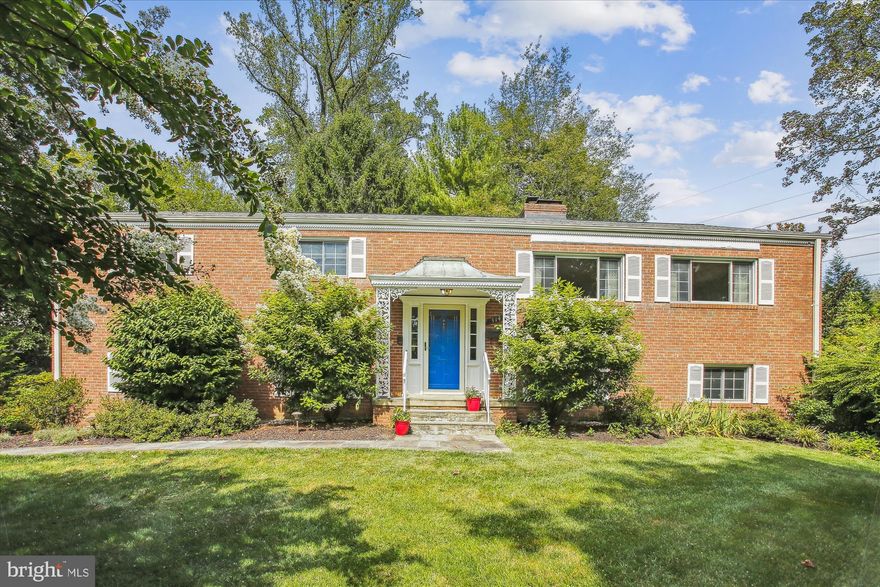 At the end of a long and beautiful street you will enter a cul-de-sac and find this solid brick home perched on a half acre and backing to the W&OD trail.   Enjoy a generous living room with gleaming hardwood floors, and oversized corner wood burning fireplace, dining area complete with a wall of mirrors, large kitchen with newer appliances, SS refrigerator, wall oven with warming oven,  exposed brick wall, eat in area and door to serene screened in porch built in 2019 and surrounded by mature trees, perennials and privacy. To finish out the main level, a primary bedroom with en suite bath (2014) and 2 good sized closets, 2 more light and bright bedrooms and a full hall bath redone in 2022. The walk out lower level greets you with brand new carpeting, fresh paint, a family room with plenty of room to spread out, another updated full bath and 3 more bedrooms with plenty of closet space. A laundry and utility room with loads of storage possibilities and door to attached garage, with newer garage door (2019). Outside you will find multiple garden areas bursting with charm and privacy. An enclosed fence area lends itself to a great place for pets and leads to the newly expanded and improved W&OD trail which you can take to East Falls Church Metro (1 mile) or to any of the wonderful restaurants, shops, farmers market, community center, State Theater or multiple grocery store options. Nothing in Falls Church City is more than 2 miles from the centrally located lovely home.  Falls Church City Schools, with brand new modern Meridian HS. Make a point of seeing this oasis in the middle of it all! Photos and Floor plans will be uploaded on 9/1