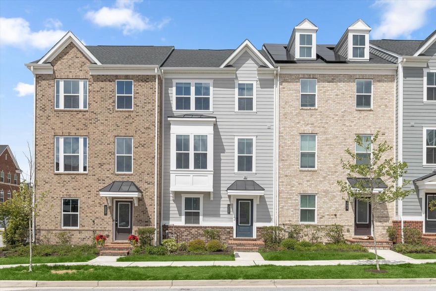 Welcome to Bevington—where luxury, lifestyle, and convenience come together in a home that truly shows like a model. Built in 2021, this stunning 4-bedroom, 3.5-bath townhome offers the feel of brand-new construction—without the wait or premium price tag.

From the moment you step inside, you’re greeted by a bright, airy foyer that sets the tone for what’s to come. The entry level offers a versatile private suite—perfect for guests, a home office, or fitness space—complete with a full bath and easy access to the 2-car garage.

Upstairs, prepare to be impressed. The main living level is an absolute showstopper—an expansive, sun-drenched open concept space designed for both everyday living and unforgettable entertaining. At the center is a sleek, modern kitchen featuring a massive island with built-in sink, granite countertops, stainless steel appliances, abundant cabinetry, and a spacious pantry. The dining area flows seamlessly to a rear Trex deck—ideal for morning coffee or evening gatherings—while the light-filled living room offers the perfect place to unwind or host.

The upper level delivers a true retreat. The serene primary suite features a tray ceiling, walk-in closet, and a spa-inspired bath designed to impress—complete with dual vanities, a soaking tub, and a beautifully tiled walk-in shower with bench seating. Two additional spacious bedrooms, a full hall bath, and a convenient laundry area complete this level.

Located in the highly desirable Greenleigh community, you’ll enjoy resort-style amenities including a clubhouse, fitness center, outdoor pool, parks, playgrounds, and scenic walking trails. All of this just minutes from I-95 and I-695, plus endless shopping and dining options.

This is the one that checks every box—and then some.
Schedule your private showing today before it’s gone!