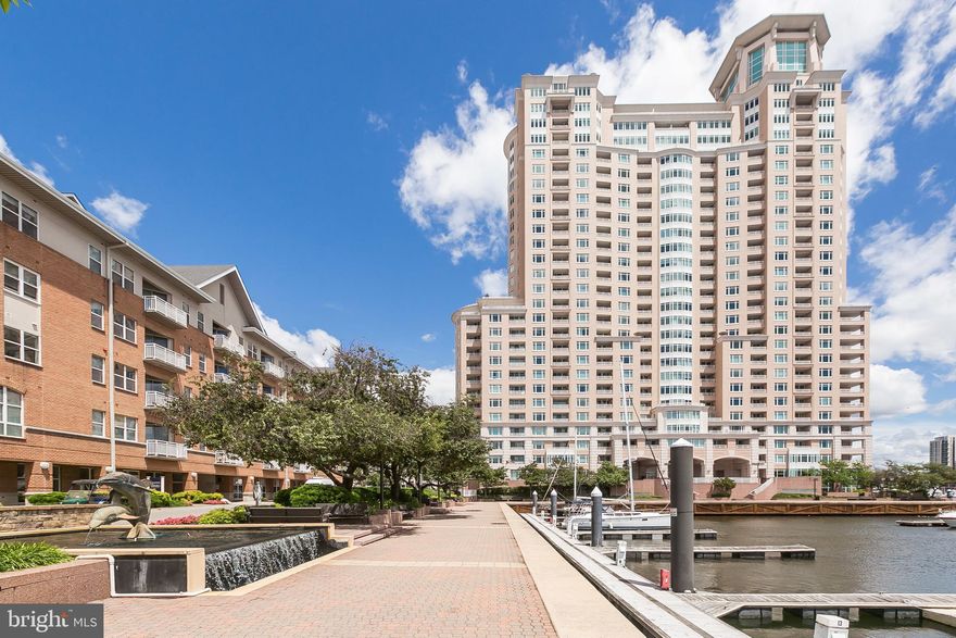 SPECTACULAR CITY LIGHTS AND WATER VIEWS! Apartment offers open floor plan and balcony with breathtaking sights of Baltimore's Inner Harbor! Rent includes garage parking, water and many building amenities. Interior highlights include light wood floors, kitchen pass thru, NEWER KITCHEN PAINT-NEUTRAL TONE, granite countertops and decorative tile backsplash, double bowl kitchen sink, washer/dryer, earth-tone bath tile surround. Main Suite offers stylish glass pane French door entry and spacious walk-in closet. PARKING, WATER, and Amenities included in rental rate!!  Luxury full service building with loads of value added amenities and services! 24/7 front desk offers concierge, doorman, billiard room, social lounge, conference rooms, outdoor patio grill area, fitness center with steam and sauna, guest suites, business center! Community grounds are beautifully landscaped with walking/jogging paths, seasonal flowers, water fountains. On-site Gourmet Deli, patio dining, security staff, and plenty of guest parking. Close to eating establishments, shops, stadiums, business district, MARC train and only 10 miles to BWI International Airport!