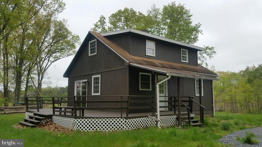 Ready to Go! Nice cabin with easterly view, fire place, lots of decking and newer flooring, windows, paint, recently renovated. 2 plus bedrooms and large main room, laundry / utility room, All setting on 5 acres not to far from Cacapon State Park and Sleepy Creek Wildlife Management Area for all your outdoor activities. Call Today!