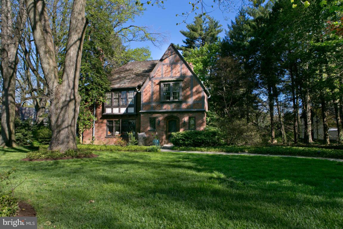 Fabulous Brick Tudor situated on a private, beautiful lot! Amazing architectural details with exquisite moldings in LR & DR, arched doorways, leaded glass windows and doors throughout much of the home. Spacious rooms, renovated kitchen with new stainless appliances, porcelain tile floors & new baths. Many built-ins & plenty of closets. New high efficiency gas heating system. Detached 2 car garage with storage. One of a kind!