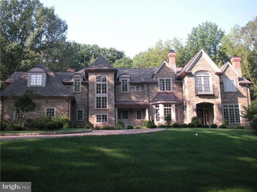 This stone French Country style manor house sits atop a 1.9 acre hillside overlooking the Whitemarsh Valley. It borders acres of nature preserved woodland and the landscaped yard has blooms from spring to fall. There are wonderful scenic views from every window. Built by developer, Sam Blake, the attention to architectural detail, craftsmanship and finishes are superb. A top of the line kitchen has every amenity and is surrounded by an open floor plan including a family room, wet bar, and breakfast room. There is a lovely master suite which includes a sitting room with fireplace, bedroom, two walk in closets and a large master bath with Jacuzzi and heated floors. There are four additional rooms and four baths. Large spacious finished lower floor with rec room with a fireplace and a large workout room, full bath and wine cellar. Within walking distance to shops, train and Chestnut Hill. AKA 8836-8838 Montgomery Ave.
