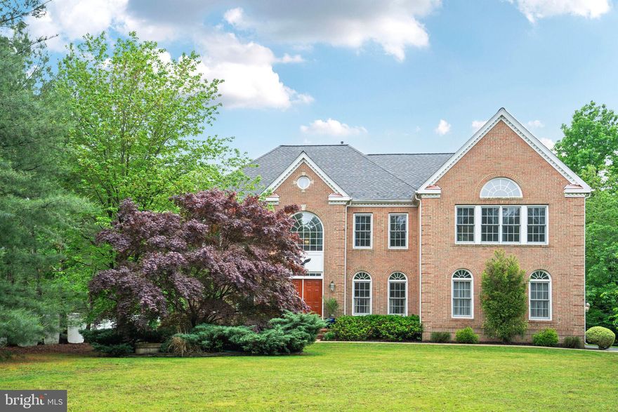 This immaculate Colonial on a spectacular half-acre lot is beautifully appointed and offers over 5,700 square feet of finished, well-thought-out open living space. The house is located in the Belmont Park Estates waterfront community on sought-after Mason Neck, has no HOA, and offers exclusive access to Foster Park on Belmont Bay. This private 7-acre community park has an expansive waterfront picnic area with tables, grills, and a dock with navigable water from Belmont Bay to the Potomac River.

The home features dual staircases, an amazing chef’s gourmet kitchen with a huge walk-in pantry, an enormous family room with a stunning floor-to-ceiling stone hearth fireplace that’s either woodburning or propane gas, an immense primary bedroom with cathedral ceilings, a sitting room, and Juliet window, dual walk-in closets with laundry chute, a luxury salon bathroom with glass shower and jacuzzi tub, a finished walk-up basement with a bright recreation room, fully-equipped wet bar with wine cooler and an ice machine, a media room/home theatre with a beverage center, a game room with dance floor/lighting and billiards, an optional 5th bedroom with full bathroom and jetted tub, two-tier composite deck with hot tub, a cottage-style storage shed with abundant storage space, and a serene, completely private, level backyard. Enjoy nature at its best.

Mason Neck is a sanctuary in Fairfax County famous for its beauty, historical significance, waterfront, and nearby access to I-95, VRE, the Springfield Metro, Mason Neck State Park and Wildlife Refuge, Meadowood Special Recreation Area, Pohick Bay Regional Park, Pohick Bay Golf Course, Gunston Hall (home of George Mason), Fort Belvoir, and Occoquan. The area offers unparalleled walking, biking, boating, fishing, bird watching, horse trails, and much more!