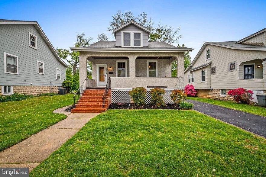 With approximately 2,000 sq. ft of finished space, this 4 bedroom, 2.5 bath "tabby-shell" stucco cape cod home in sought-after Hamilton Heights offers a blend of original character and thoughtful updates including the option for a main level primary bedroom! You'll love the covered front porch (with swing!) that welcomes you into a light-filled living room featuring stained glass accents, a decorative fireplace with wall sconces, and hardwood inlay floors. The dining room flows seamlessly into an updated kitchen with maple cabinetry (soft-close), granite countertops, subway tile backsplash, pantry storage, stainless steel appliances, gas cooking, and so much more.

The main level includes two bedrooms with hardwood floors, along with a beautifully renovated full bath (2021). Upstairs, you’ll find two additional bedrooms—both with hardwood floors and generous closet space—plus an updated full bath with double vanity and ceramic tile.

The finished lower level offers flexible living space with recessed lighting, built-in cabinetry, a stylish wet bar, powder room, and a large utility/laundry/storage area with walk-out access to the rear yard.

Outdoor living is equally appealing with a spacious deck, fenced level yard, and a gas line for convenient grilling. Recent improvements include a newly paved driveway and freshly painted interior spaces, enhancing both curb appeal and move-in readiness.

Important updates include dual-zone HVAC (2019), stainless steel appliances (2018), main level bath renovation (2021), and upper-level hardwood flooring (2015).