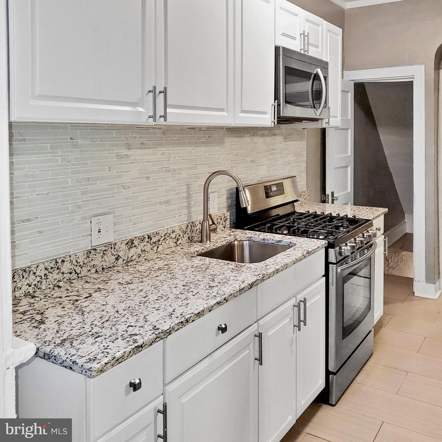 CONTRACT FELL THROUGH, DONT MISS YOUR  CHANCE TO OWN YOUR DREAM HOUSE!! FULLY RENOVATED FROM TOP TO BOTTOM! Upgrades to include new  beautiful Luxury Laminate flooring  and paint through the entire house, that just shines when the morning sunlight glares through amazingly large windows . Luxury custom kitchen with granite counter tops and family style  breakfast bar, with an amazing matching backsplash and Samsung stainless steel appliances! 3  Large bedrooms, with ceiling fans in each room and 2 Beautifully built custom  full bathrooms.  BRAND NEW LIGHT FIXTURES, FINISHED AND SPACIOUS BASEMENT WITH LUXURY VINYL FLOORING, KENMORE WASHER AND DRYER, NEW GOODMAN HVAC AND NEW ROOF ( NOT EVEN A YEAR OLD). This house is walking distance from major train stations, minutes from the Pimlico and highway minutes away! Large backyard meant for amazing family gatherings or turn it into a Family driveway!! Don't wait any longer and  schedule your showings today!