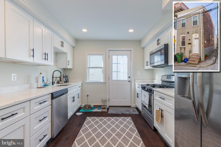 SIMPLY CHARMING FELLS POINT RENOVATION WITH DESIGNER FINISHES AND PARKING PAD!  Open floor plan with hardwood floors throughout, inviting living room and dining area, attractive kitchen w/ Quartz counters & ss appliances, main level half bath, upper level w/ 2 bedrooms and 1 full bath and easy off street parking!  Centrally located between Patterson Park, Canton, Fells Point, and the waterfront!  Pack your bags and move right in!