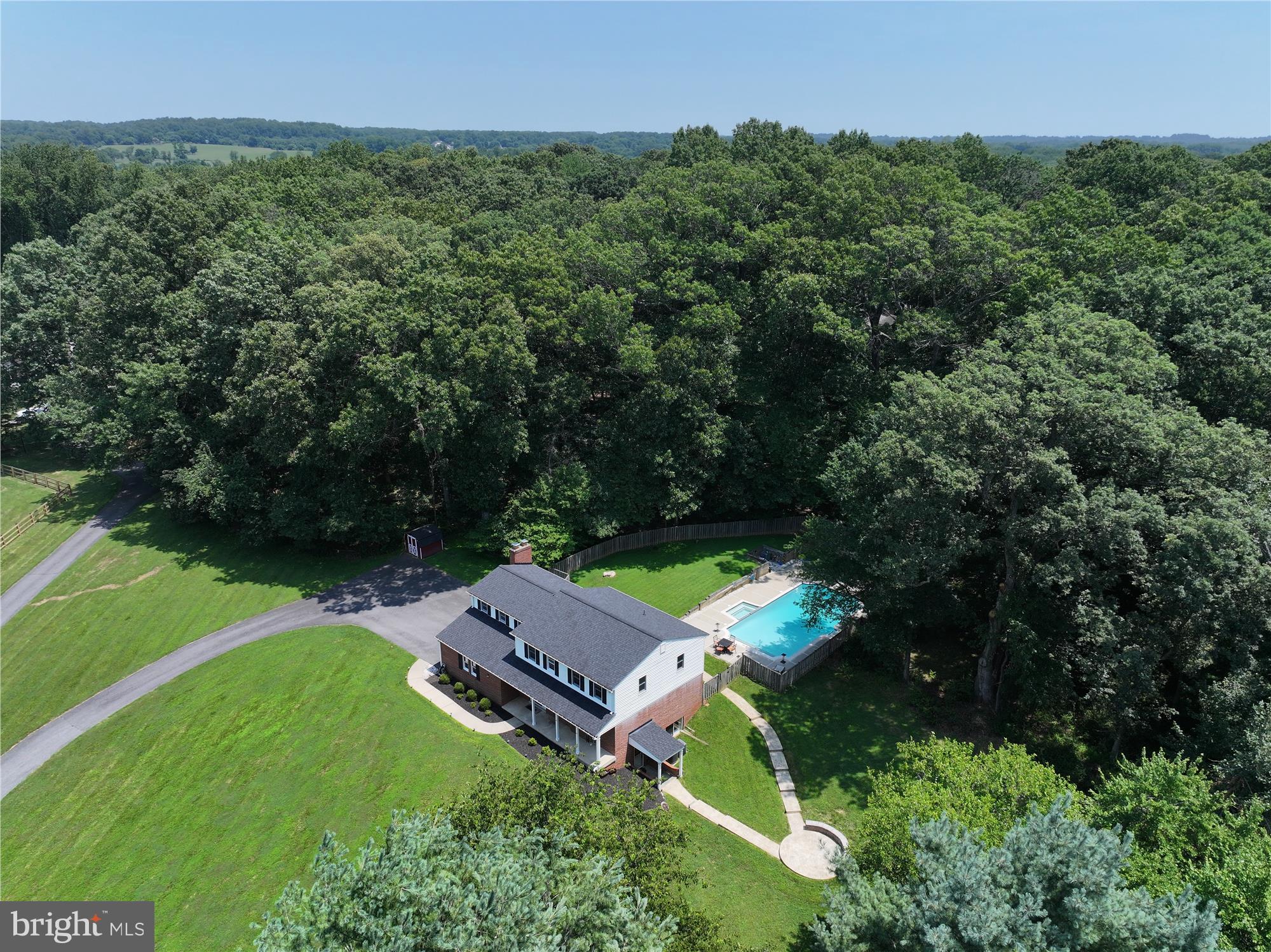 Welcome to this meticulously maintained residence, a true gem located on over 2 acres in Mill Creek Towne East. This home offers the views, setting, and relaxation of a secluded country estate while being only three miles from Metro, Route 200, and minutes from I-270. With six legal bedrooms, a two-car garage, and an oversized driveway, this residence provides ample space for family and guests.
One of the standout features of this home is the backyard oasis, complete with a beautiful in-ground pool, patios, and a tranquil terrace in the side yard. Additional highlights include an updated roof, gutters, and well pump (all in 2021), fresh paint, updated carpet (2024), a new hot water heater (2018), and a pool renovation (2019).
The finished, walk-out lower level, featuring a wet bar, full bath, recreation area and bonus space, is incredibly versatile. This area can easily be used for a home gym, a cozy media room, home office, and extra space for entertainment and play. Enjoy nearby Lake Needwood, Rock Creek Park, golf, and other local activities. Welcome Home!