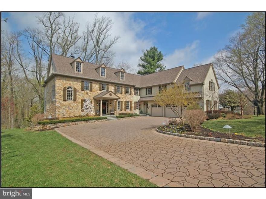 Taxes have been successfully appealed and will be reduced by approx. $4,800. Welcome to 343 BerwynBaptist Rd, an exquisite custom home built by luxury builder Ted Babiy, which is part of cluster of newer homes. This beautiful 12-year young home is set on a private 1.13 acre park-like setting yet is close to all: train and other transportation, dining & shopping. From the moment you pull onto the custom paver driveway, you will know that you have come to a home like few others. The manorly stone facade is further enhanced by the upgraded carriage-style garage doors on the 3-car garage & stone retaining walls that created raised flower beds along the driveway. Enter the home via the front portico & find a layout which allows living spaces to benefit from the outstanding views of the very private rear yard. Upon entering you will find the formal living with its beautiful custom millwork of built-ins around the wood-burning fireplace & the coffered ceiling. Four sets of French doors lead the a large rear deck from the living, dining, breakfast and family rooms. The living room flows into the dining room which has crown molding & chair rail. The dining room then flows in the kitchen that opens to the breakfast and family rooms. These room are also connected by a light-filled front hallway. The perimeter kitchen cabinets are birch and the island is a darker color. There is a comfortable flow and size the open-concept living area of the kitchen, breakfast & family rooms. Numerous windows and the two pairs of French doors allows tons of light to stream in. The home has front & back staircases and a large mudroom with cubbies by the family powder room. To the left of the front door find light-filled office that would be a very relaxing place to read a book and take in the views of nature and birds who fill the trees. There is a formal powder at this end of the house as well. Upstairs find hardwoods in hallways and newer carpet in all the bedrooms. The master bedroom with large dressing area, 2 walk-in closets and a large master bathroom with his and her vanities, a large shower with custom shower heads and body sprays, a large soaking tub, and a separate WC. 4 bedrooms each have Jack and Jill baths. The lower level is walk-out and finished a powder room and loads of storage areas. The oversized paver driveway can accommodate up to 14 cars during a party and the neighbors allow overflow parking on their drives when a neighbor is entertaining. Welcome Home!