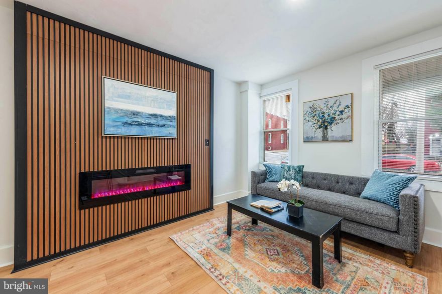 Welcome to 3514 Barclay Street — a beautifully updated porchfront home nestled in the heart of Baltimore’s vibrant Barclay neighborhood.

Step inside to discover brand new flooring throughout the main level, highlighted by a stunning accent wall and a sleek electric fireplace that creates a warm, modern focal point in the living space. The layout flows seamlessly into a separate dining room — perfect for gatherings — and a galley kitchen featuring granite countertops, stainless steel appliances, and crisp cabinetry that blends style with function.

Upstairs, you’ll find three comfortable bedrooms with plush new carpeting and generous natural light. The beautifully updated bathroom showcases elegant Italian tile finishes, adding a touch of luxury to your daily routine.

Enjoy the charm of classic Baltimore architecture paired with today’s modern updates, all from the comfort of your inviting front porch.

Located in Barclay, you’re just minutes from Station North Arts District, local cafes, parks, Johns Hopkins University, and convenient commuter routes. This neighborhood offers a strong sense of community, ongoing revitalization, and easy access to Downtown Baltimore.