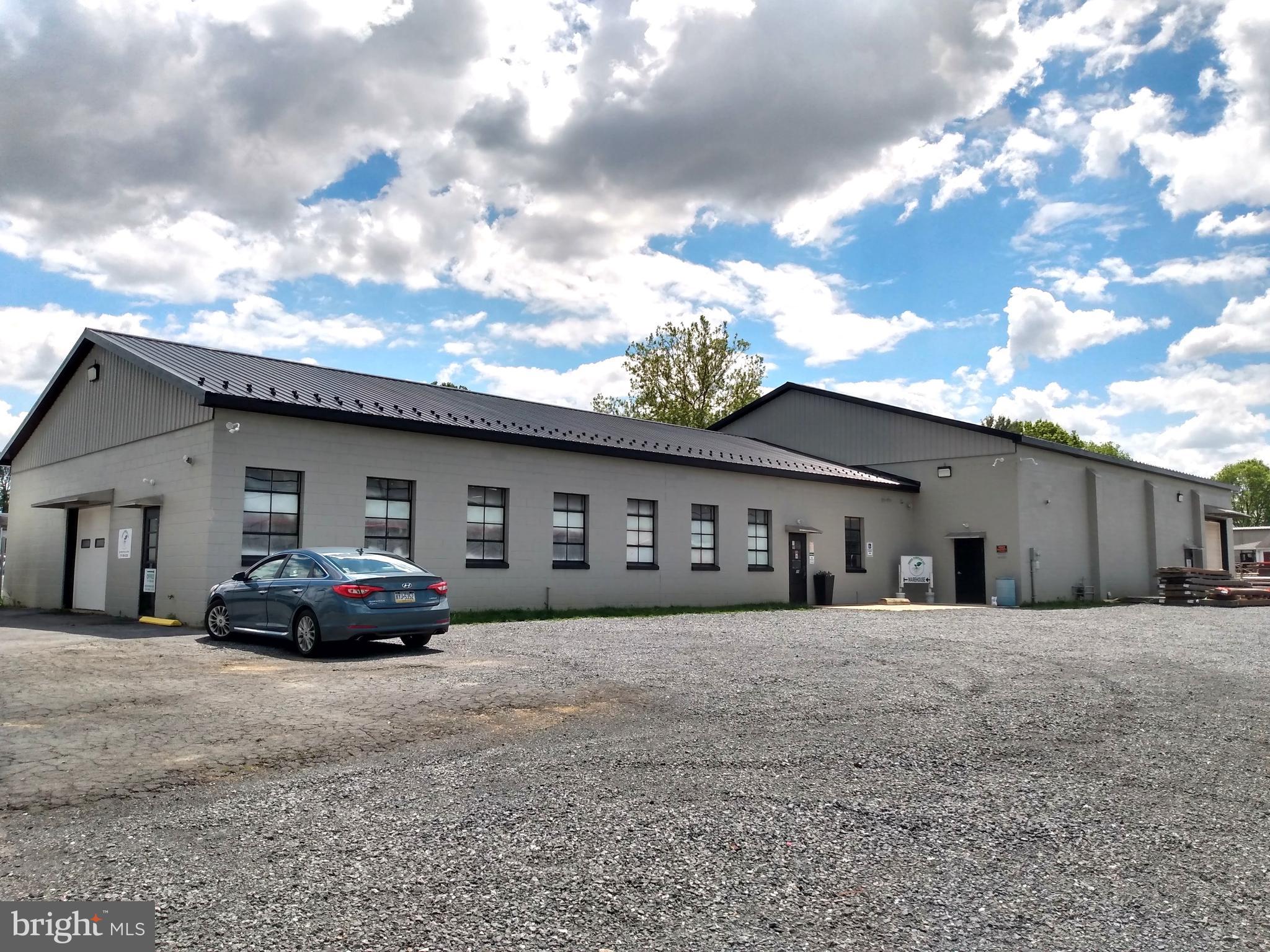 MEDIUM MANUFACTURING ZONING! Great building on corner lot and in a fabulous location. Front building is 3600 square feet with 10 ft clear span and a 8ft drive-in overhead door. Rear building is 4640 square ft with 14ft clear span and a 12ft drive-in overhead door. Building includes corner office with bathroom. Surrounding parking area could accommodate up to 50 cars. Currently being used as retail and warehouse space. Space can be made available quickly.