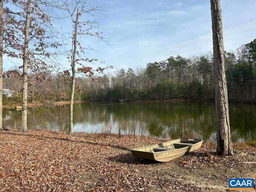 Very private wooded lot close to Charlottesville.  10+ acre lot in all hardwoods with approximately 4 acre lake.  Gently rolling parcel with mature hardwoods.  Driveway and homesite have been cleared.  You can drive back to the lot easily.  Only 15 minutes to Charlottesville.  Firefly Fiber is installed to the road.  Soil work attached.