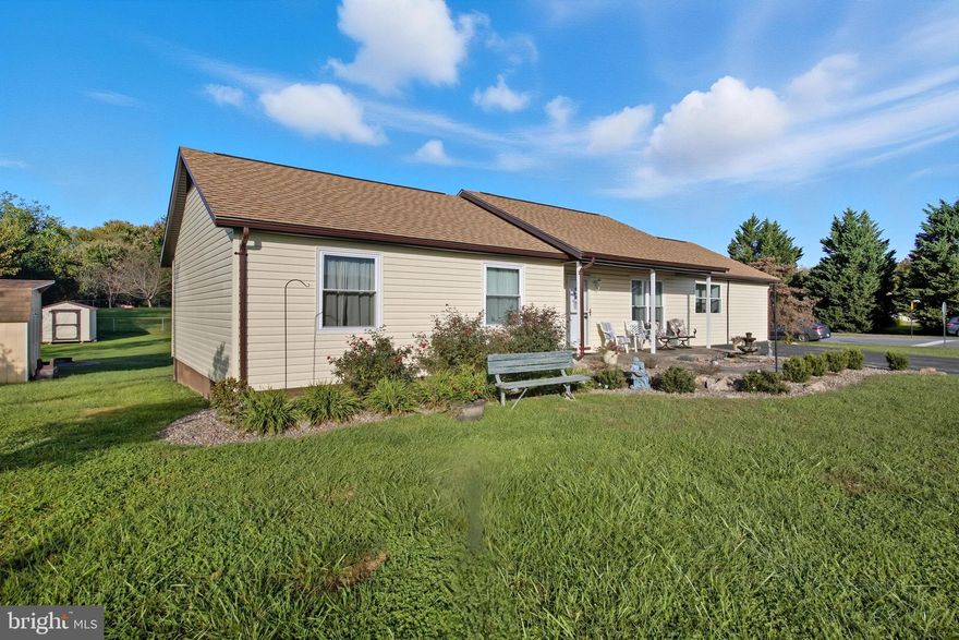 Welcome to 279 Patrick Henry Way! This beautifully updated  home offers the perfect blend of modern convenience and comfort in a prime location. As you arrive, you’ll be greeted by a charming walkway accented with manicured bushes and a lovely fountain. The thoughtfully designed landscaping, featuring river rock, creates both beauty and low-maintenance ease. Step inside to a bright and inviting formal dining room, ideal for entertaining and holiday gatherings. A stylish wall opening connects the dining area to the kitchen, creating an open flow throughout the main living spaces. The kitchen serves as the heart of the home, offering central access and the convenience of an adjacent laundry area. The spacious living room is filled with natural light from grand windows and includes a built-in kitchenette, adding versatility for entertaining or extended family. This home offers four bedrooms and three full bathrooms, providing ample space and comfort. One bedroom and bath are located off the living area, while the remaining three bedrooms and two baths, including a private primary suite, are situated on the opposite side of the home, offering privacy and comfort. Combining generous space, a thoughtful layout, and a prime location, this home delivers exceptional value. Don’t miss your opportunity, schedule your showing today!