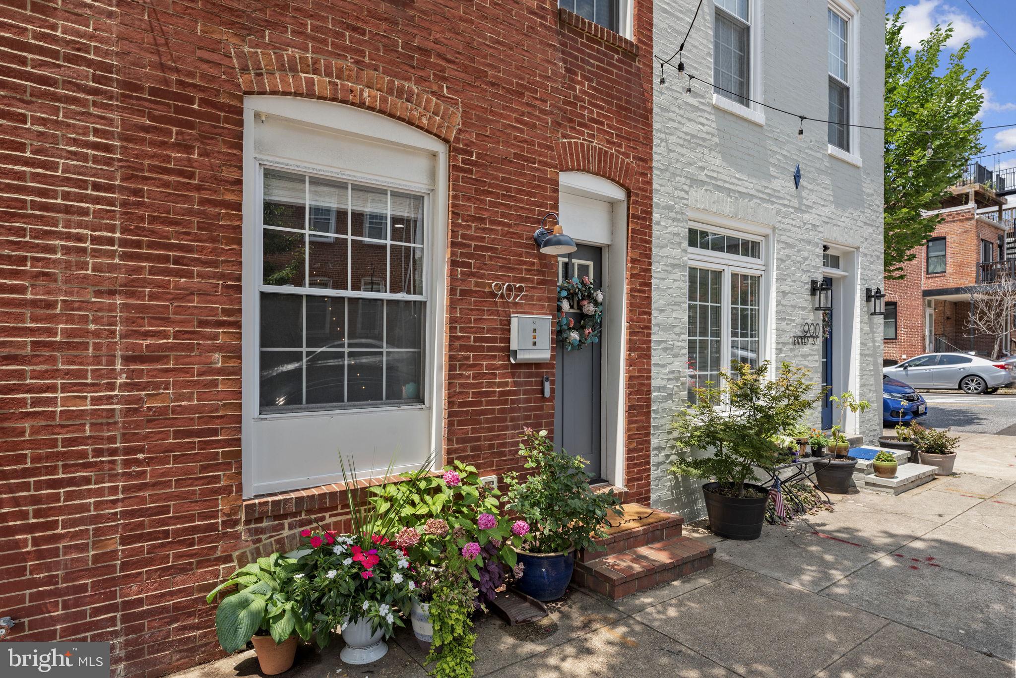 Beautifully designed and ideally located in the heart of Canton, this stunning townhome—recently renovated with thoughtful attention to detail—offers four fully finished levels of stylish living. Step inside to hardwood floors, exposed brick, custom metal stair railings, and controllable recessed lighting built into the staircases for a dramatic touch. The bright, white chef's kitchen features quartz countertops, custom cabinetry with wine storage, a designer tile backsplash, and stainless steel appliances—including a gas range with microwave rangehood. Just off the kitchen, enjoy a private rear patio with a hand-painted floor design, perfect for outdoor dining or relaxing.
The second level offers two spacious bedrooms, a hallway full bath, a laundry nook, and extra closet storage. The top level is a private owner's retreat, featuring a full en-suite bath, a private deck, and access to a newly stained and sealed rooftop deck with stunning views of the city and Inner Harbor—this home is one of the tallest in the neighborhood! Both the rooftop deck and the owner's private deck have been recently sealed and stained for lasting beauty.
The finished lower level includes a full bath and a versatile bonus room ideal for a guest bedroom, home office, or gym. A highly protective Gaco waterproof silicone system has been installed on the entire roof for added peace of mind.
Located on the same block as one of Baltimore's best coffee spots—OneDo—and close to Safeway, Canton Square, Patterson Park, and Canton Waterfront Park, this home offers the perfect blend of modern comfort and unbeatable location.