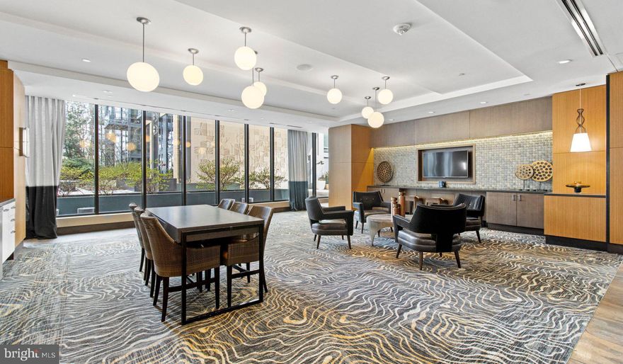 Nestled in the vibrant heart of Bethesda, Maryland, this luxury apartment complex offers an unparalleled living experience that combines modern convenience with sophisticated design. Designed to cater to the discerning tastes of urban dwellers, this property stands as a testament to luxury living, where every detail has been meticulously crafted to ensure the utmost in comfort and style.

*Exceptional Location*
Located in the sought-after Woodmont district, the apartment complex is perfectly positioned as a gateway to the best that Bethesda has to offer. Residents enjoy easy access to a plethora of amenities, including the Walter Reed National Military Medical Center, the NIH, and a variety of shopping, dining, and entertainment options. The prime location also offers convenient access to public transportation, making it easy to explore the wider metropolitan area.

*Architectural Elegance and Design*
The building's U-shaped design opens up to a beautifully landscaped courtyard, offering a seamless transition from the bustling city life to a tranquil oasis. The architecture is both richly textured and humanly scaled, creating an inviting streetscape that residents are proud to call home. A dramatic window wall façade and ground-level duplex units with front porches and planters further enhance the building's aesthetic appeal.

*Luxurious Amenities*
Residents of this apartment complex enjoy access to an array of exceptional amenities designed to enhance their lifestyle. The property boasts a large fitness center, fireside lounges, and a rooftop lounge equipped with bars, fireplaces, grilling areas, and two pools. Additionally, the convenience of having a 50,000 square foot grocery store within the building cannot be overstated. The property is also LEED Gold Certified, reflecting a commitment to environmental sustainability.

*Sophisticated Living Spaces*
The apartments themselves are a reflection of the luxury and sophistication that define the property. With a variety of floor plans, including studios, one to three-bedroom apartments, and townhomes, there is something to suit every preference. Each unit features designer finishes, stainless steel appliances, and spacious layouts that make coming home a pleasure.

*Community and Convenience*
The property is known for its friendly and helpful staff, ensuring that the needs of residents are met with professionalism and care. The well-maintained common areas and the sense of community fostered among residents make this complex more than just a place to live—it's a place to belong.

This luxury apartment complex in Bethesda, Maryland, offers an unmatched living experience for those seeking the best in urban living. With its prime location, architectural elegance, luxurious amenities, and sophisticated living spaces, it stands as a beacon of modern luxury and convenience. Realtors and renters looking for a property that combines the vibrancy of city life with the comfort of upscale living will find everything they desire and more at this premier apartment complex.

** Pricing and availability subject to change on a daily basis ** Photos are of model units ** Parking may be available for additional fee **