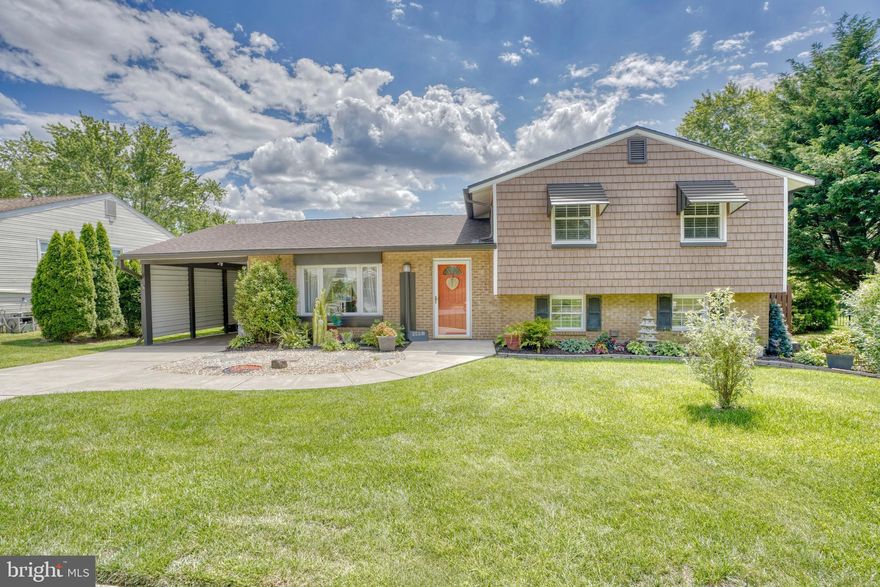 YES- Back on the market! This home is so welcoming and perfectly set-up that you will never want to leave.  Owners have lovingly cared for their home over the years. Living room is open into dining area with glass doors that bring the lush green outside into view. Kitchen is open on to dining area for easy serving. There is a half bath, a laundry room and another bonus room that is currently used as a workshop,  Family room has direct walk-out access to a large patio, strategically placed flower gardens for maximum privacy and another proven great location for vegetable and herb gardens, Carport has a new ceiling with pull-down stairs to storage area. You will see the garden tool shed near the carport and there is a potting shed as well.
Fireplace in family room comes with pellet-stove insert. Glass bar and small refrigerator in family room will convey.