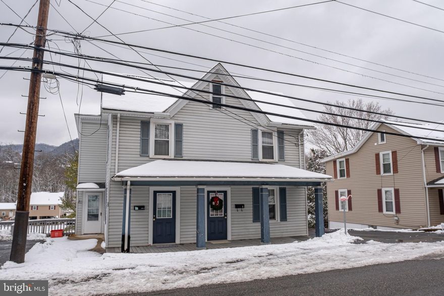 Bellefonte, Spring Township Duplex – Excellent Investment or Owner-Occupant Opportunity! Well-maintained duplex offering one leased unit and one move-in ready unit. 925-1 is a spacious 2 BR, 1 BA unit featuring hardwood flooring in the foyer, living room, and dining area, newer vinal windows including screens, an eat-in kitchen, and carpeted bedrooms. Range and refrigerator included (as-is). Additional features include an unfinished walkout basement with W/D hook up, a deck, a shed, and 1 off-street parking space. Tenants each pay electricity, units are metered separately and electric baseboard heat in both.  Landlord pays for water, sewer, and trash. Lease in place until May 30, 2026. 925-2 is a 1 BR, 1 BA unit with LVP flooring downstairs, carpet in bedroom, newer vinal windows including screens, Range, and over the range microwave included in unit (as-is), W/D hookup in unit, washer and dryer included (as-is) but no basement walkout or deck. This unit is vacant and ready for immediate occupancy, making it ideal for leasing or for an owner to live in while collecting rental income from the other side. A great opportunity to live on one side and rent the other-offering the best of both worlds in Bellefonte! *Pictures for the Occupied Apt are from when the seller had it listed for rent*