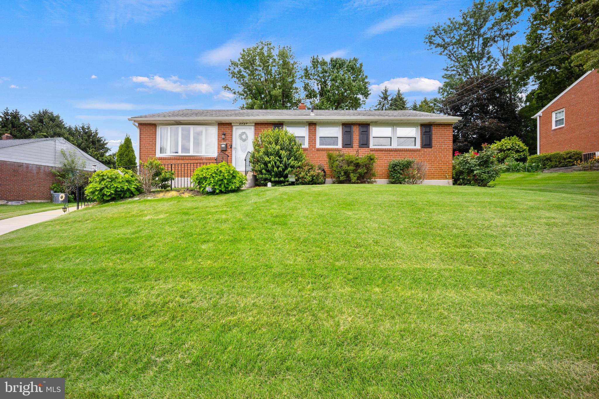 Welcome to 4947 Jackson Dr! This beautiful rancher is move in ready for it's new owners looking for one floor living. Enter into your spacious and bright living room with a bow window and hardwood floors that continue into your dining room. The dining room allows for formal dining or eat-in kitchen with the open kitchen and breakfast bar. The kitchen has been updated with granite counter tops, stainless steel appliances, subway tile backsplash, and plenty of cabinet and counter top space. There is also a door for easy access to your huge backyard, with mature landscaping for privacy, and a patio, great for relaxing in the evening. Inside, down the hall is a full bathroom with ceramic tile and 3 nice size bedrooms all with ceiling fans and good closet space. The main bedroom also has an en-suite updated full bath with tile shower. The basement has been beautifully finished for extra living space for whatever you may need, office/playroom/den and also has a built in bar, making a great entertaining space, and still allows for plenty of storage and laundry area on the other side. Come see this all this home has to offer today!