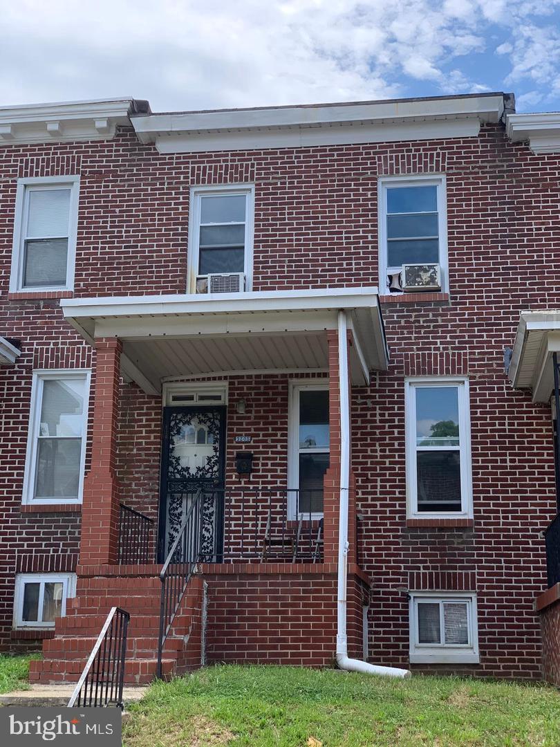 Spacious three bedroom brick townhome in convenient location. Open main level floor plan with hardwood flooring. The home features a huge covered front porch. Plenty of street parking and great access via the rear alley. Unfinished basement is ready for imagination.