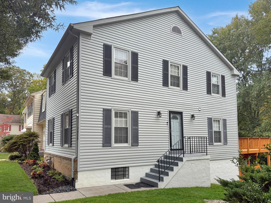 Welcome to 7310 Eggar Woods Lane, a stunning end-unit Ellenwood model backing to trees in Springfield’s sought-after Bethelen Woods. With a side entrance and windows on three sides, this bright and inviting home offers the feel of a detached house. Gleaming hardwood floors and recessed lighting flow throughout. The spacious living room features three windows that fill the space with natural light, while an elegant chair rail gives the dining room a refined touch. The beautifully renovated kitchen showcases stainless steel appliances, including a brand-new stove, sleek granite countertops, stylish white cabinetry and a deep sink with a swan-neck faucet. Step out back onto the expansive deck, complete with stairs leading down to the fenced-in yard and a serene wooded view—perfect for weekend BBQs or relaxing with a good book. Upstairs, you’ll find three generously sized bedrooms, each featuring recessed lighting and ceiling fans. The lovely owner’s suite offers two closets and a spa-like en-suite bath with floor-to-ceiling tile in the shower, a rainfall showerhead, and a built-in niche for your accessories. The lower level includes a large laundry room with additional storage and a versatile bonus room ideal for a home office, gym, or guest space. The fabulous rec-room showcases exquisite crown molding and a cozy fireplace framed by a slate surround and detailed wood mantel—ideal for winter evenings. From here, step out to the private lower deck surrounded by lush trees. The stove was replaced in 2025 and the hot water heater in 2024. This exceptional residence includes two convenient assigned parking spaces right out front, along with plenty of visitor parking. Located in a welcoming community with tot lots, walking trails, and basketball courts, this home perfectly blends comfort and convenience—just minutes from the Metro, Springfield Town Center, Fairfax County Parkway, and more.