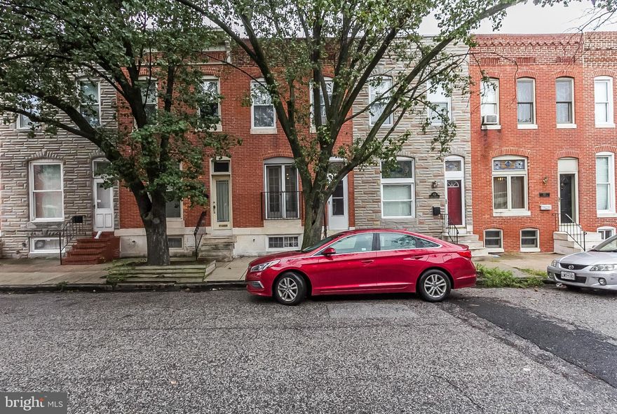 Well crafted renovation in this 13 foot wide Canton rowhm w/Garage  Fabulous kitchen (2013) with 42" custom cabinetry, SS appliances, Island w/storage and Granite countertops. Brazilian Cherry HDWD flrs. Incredible Spa-like Bath(2015) w/Designer Tile, carrera marble vanity/double sinks & shower w/rainfall feature & seamless glass door!! Rear patio, Roof deck/skyline views, loads of storage in LLVL