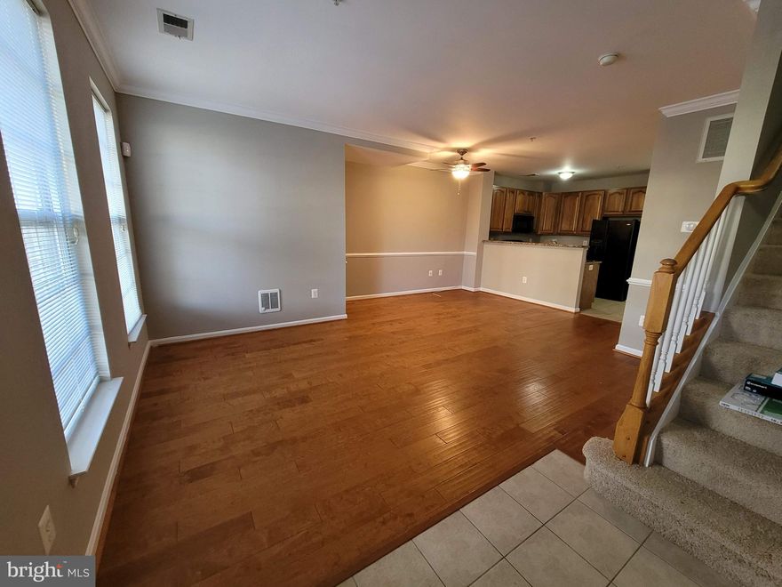 This Low maintenance, super stylish light, and bright home with 1 car garage, 3 bedroom and 2.5 bathroom, exudes pride of ownership. The open floor plan is functional and perfect. The primary suite is massive and highlighted by a huge walk-in closet, has an attached bath with separate shower and tub. There are 2 other bedrooms with their private balcony in the upper level at the end of the hall away from the primary bedroom, which gives you complete privacy. The entrance is near grade, perfect for handicap access and wheelchairs. There is a one car garage in the rear that enters the back of the unit. This unit is ready to go. Come visit this beautifully maintained condo close to VRE, Omni ride Bus, Potomac Mills Mall, and Stonebridge Town Center with restaurants, shopping, and entertainment, I95 for easy access, Quantico, and Leesylvania State Park. Schedule a showing today.