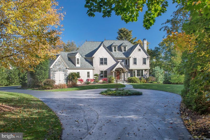 626 Hazelhurst AvenueMerion Station, PAPristine residence on nearly an acre of gorgeous grounds in prime Merion Station! This modern beauty with an expansive circular drive and stunning stone and stucco fa ade makes a striking statement. Extremely private, the house is surrounded by mature trees front and back, assuring serenity and picturesque views. It is truly a unique and desirable living destination for the family seeking that perfect combination of classic elegance, modern luxury, generous living space and superb location. Step inside beyond the elegant solid wood front door to encounter a gracious center hall foyer enriched by hardwood floors, a curved staircase and tasteful millwork. The light-bathed living room at right, currently used as a piano room, lends sophistication for entertaining with a charming wood-burning fireplace and big bay window overlooking the front property. Glass-paneled French doors lead to an adjacent private office that faces the rear yard and also connects to the family room. To the left of the entry foyer, through a wide opening sits the formal dining room graced by crown moldings and wainscoting, a perfect setting for sharing meals and celebrating special occasions. The kitchen is a masterpiece, featuring striking coffered ceilings, extensive granite countertops, a huge furniture-style center island with seating and storage, tons of cabinetry and premium appliances for the chef. Providing a seamless flow is a sun-flooded open breakfast room with access to the spacious rear patio, and a fabulous open family room with coffered and vaulted ceilings, skylights, and an architecturally distinctive fireplace. Also conveniently off the kitchen is a mudroom, adjoining the attached 3-car garage with coated floors and a built-in work area. A large coat closet and powder room complete the exquisite main level. Upstairs await tranquil sleeping quarters with 4 bedrooms, 3 full baths, and a laundry room. The luxurious carpeted master suite offers sitting and dressing areas, and spa-like bathroom with double sinks, a jetted tub, and separate shower. Bedrooms 2 and 3 share a lovely jack & jill bath with double sinks, and bedroom 4 is en-suite. A sizable unfinished area can easily be finished to suit your needs. The day-lit walkout lower level is a real showstopper and ideal for game day entertaining with travertine stone floors, high coffered ceilings, gas-burning fireplace and built-in entertainment center, glass doors to the patio with pergola, a full bath, custom mahogany wood bar with double tap keg-orator, sink and fridge, billiards area, temperature-controlled wine room, and home gym with cork flooring. All this, in a great location near the best amenities!