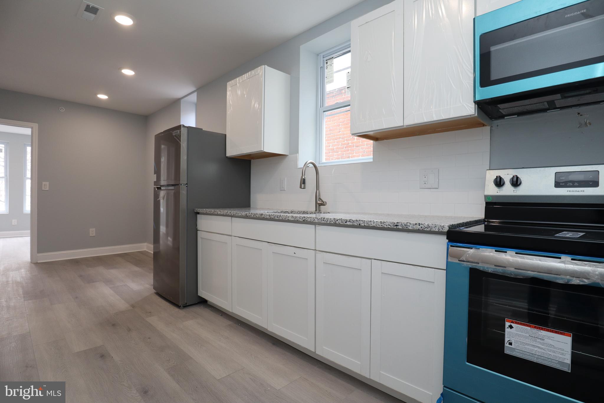 Welcome to a remarkable living experience in our recently renovated three-bedroom, one-bathroom apartment conveniently located near Temple University. This unit offers a perfect blend of style and comfort, featuring upscale upgrades that will exceed your expectations.
Step into the apartment and be greeted by luxury vinyl flooring, which spans throughout the entire unit, complemented by recessed lighting that creates a warm and inviting ambiance. The kitchen boasts elegant granite countertops and is equipped with sleek stainless steel appliances, giving the space a truly modern and sophisticated feel.
The bathrooms are designed with your relaxation in mind, featuring ceramic tile throughout and a generously sized bathtub where you can indulge in soothing soaks after a long day. Convenience is key, and this unit includes a large stackable washer and dryer to effortlessly handle all your laundry needs.
Ensuring your peace of mind, the apartment building is equipped with a contemporary electric keypad on the door, providing both easy access and enhanced security for your utmost convenience and safety.
In addition to its stylish features, this apartment also offers ample storage space in each of the bedrooms, allowing you to keep your living areas organized and clutter-free.
Don't miss out on this spacious and modern apartment that offers an exceptional living opportunity. Contact us now to schedule a viewing and secure your new home today.