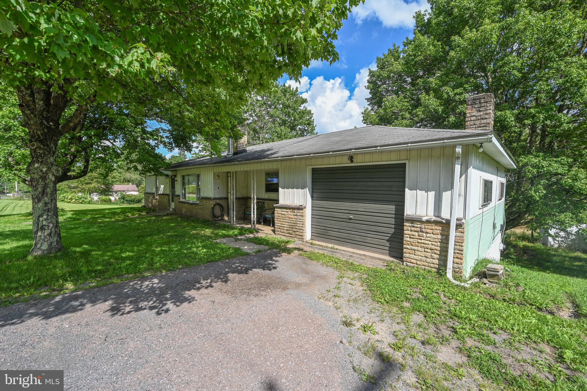 Charming ranch-style home offering 3 bedrooms, 1 full bath, and loads of potential! This one-level home sits on over 12 beautiful acres, providing plenty of space for outdoor activities, gardening, or even future expansion. The attached garage adds convenience, and the layout makes for easy, comfortable living. While the home does need some TLC, it’s priced to sell and perfect for those looking to build equity or invest in a peaceful country retreat. Located just minutes from the town of Oakland, MD, you’ll enjoy small-town charm with nearby shopping, dining, and local events. Plus, Deep Creek Lake is only a 15–20 minute drive away—ideal for weekend getaways, water sports, or winter skiing. With a little vision and effort, this property could shine again. Whether you're seeking a full-time residence, vacation home, or investment opportunity, this affordable acreage and location are hard to beat. Don’t miss your chance to own a slice of Garrett County countryside!