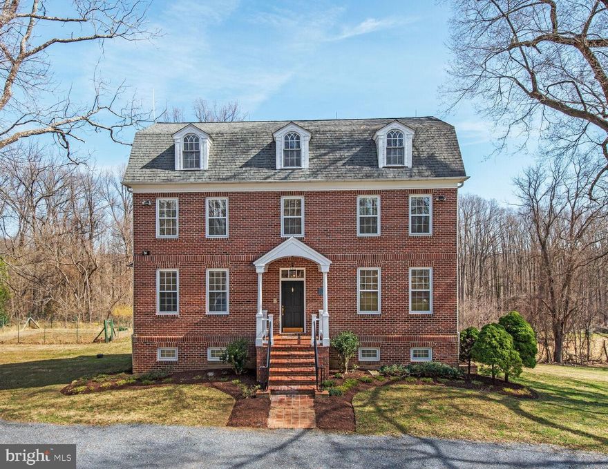 Welcome to your dream home, a stunning all brick custom built, one of a kind Colonial-style residence nestled on a generous 1.53-acre lot, offering a perfect blend of comfort, style, and natural beauty. Built in  late 90's, this well-maintained property boasts 3,360 square feet of finished living space (and an additional 1,450 of space awaiting your finishing touches, featuring four spacious bedrooms and three full bathrooms, making it an ideal sanctuary for relaxation and entertaining. As you step inside, you are greeted by a warm and inviting atmosphere, enhanced by elegant crown moldings, French doors. beautiful wood floors and large windows which let in lots of natural light.  The traditional floor plan seamlessly connects the living areas, including a spacious family room with a cozy wood burning stove off the kitchen, perfect for gatherings. The eat-in kitchen is a chef's delight, equipped with new granite countertops, brand new upgraded stainless steel appliances, and a convenient island, making meal preparation a joy. Enjoy your morning coffee in the breakfast area, or at the kitchen table space, surrounded by natural light streaming through the bay windows. The interior features are designed for modern living, including a central vacuum system, intercom, and recessed lighting throughout. The primary suite offers a luxurious retreat with a walk-in closet and an en-suite bathroom, ensuring privacy and comfort. Additional highlights include a  spacious recreation room on the upper level with access to attic space for extra storage and a sun lit walkout basement with a workshop, providing endless possibilities for customization. The basement has lots of windows and has been framed in and awaits your finishing touches. Step outside to discover your own private oasis in a natural setting. The exterior features a lovely front porch and a deck with stairs leading to the back yard, perfect for outdoor entertaining or simply enjoying the serene views of the landscaped yard, mature trees, an orchard including 10 fruit trees (2 Fig , 4, Paw-Paw, 1 Persimmon, 1 Apple, 1 Cherry, 1 Plum and Black Walnut throughout the orchard) and a gentle creek which backs onto a parkland known as Reddy Branch Stream Park. The property is designed with sustainability in mind, featuring solar panels, geothermal heating and cooling systems, and a fenced vegetable garden, allowing you to embrace a greener lifestyle. Parking is a breeze with a private driveway accommodating up to four vehicles. Security features, including exterior cameras and motion detectors, provide peace of mind. Located in a tranquil setting, this home offers the perfect escape while still being conveniently close to local amenities. The neighborhood is very close knit, and very pet and child friendly.  Don’t miss the opportunity to make this enchanting home your own!