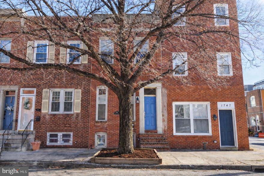 The best of all worlds — classic Baltimore charm with modern  design and exceptional convenience. This quintessential row-home features exposed brick and open contemporary living spaces. The rooftop deck offers amazing views of the Baltimore skyline and two private parking spaces complete the package.  Walk to nearby parks, dining, shops, and neighborhood favorites, with easy access to the Inner Harbor, stadiums, transit, and downtown.