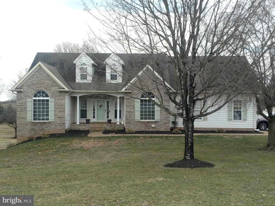 Very Attractive Turn Key Split Bedroom Rambler on approximate 2 acres. with totally private in-Law Suite/Apartment on lower level with separate entrance and parking.  Enter home in large foyer embraced by columns leading into Large Great Room boasting hardwood flooring (currently with removal custom-fitted rug,) cathedral ceiling, gas fireplace. Kitchen lined with White Cabinets with granite counters, black appliances, breakfast bar, breakfast eating area, Spacious Master bedroom with large walk-in closet and master bathroom with double sinks, separate shower and spa tub.  Large deck overlooking backyard with scenic views.   Lower Level:  In-Law Suite/Apartment has level entrance into large living area starting with a family room with a gas fireplace, full equipped kitchen and separate area for dining table. Large Bedroom with entrance to full bathroom.  Small room for nursery, office, playroom  or storage.  The Full House Generator conveys.  2017 HVAC System.  Interior freshly painted with neutral colors. (Note  the pool in backyard is a "Dogie" pool with platform.)