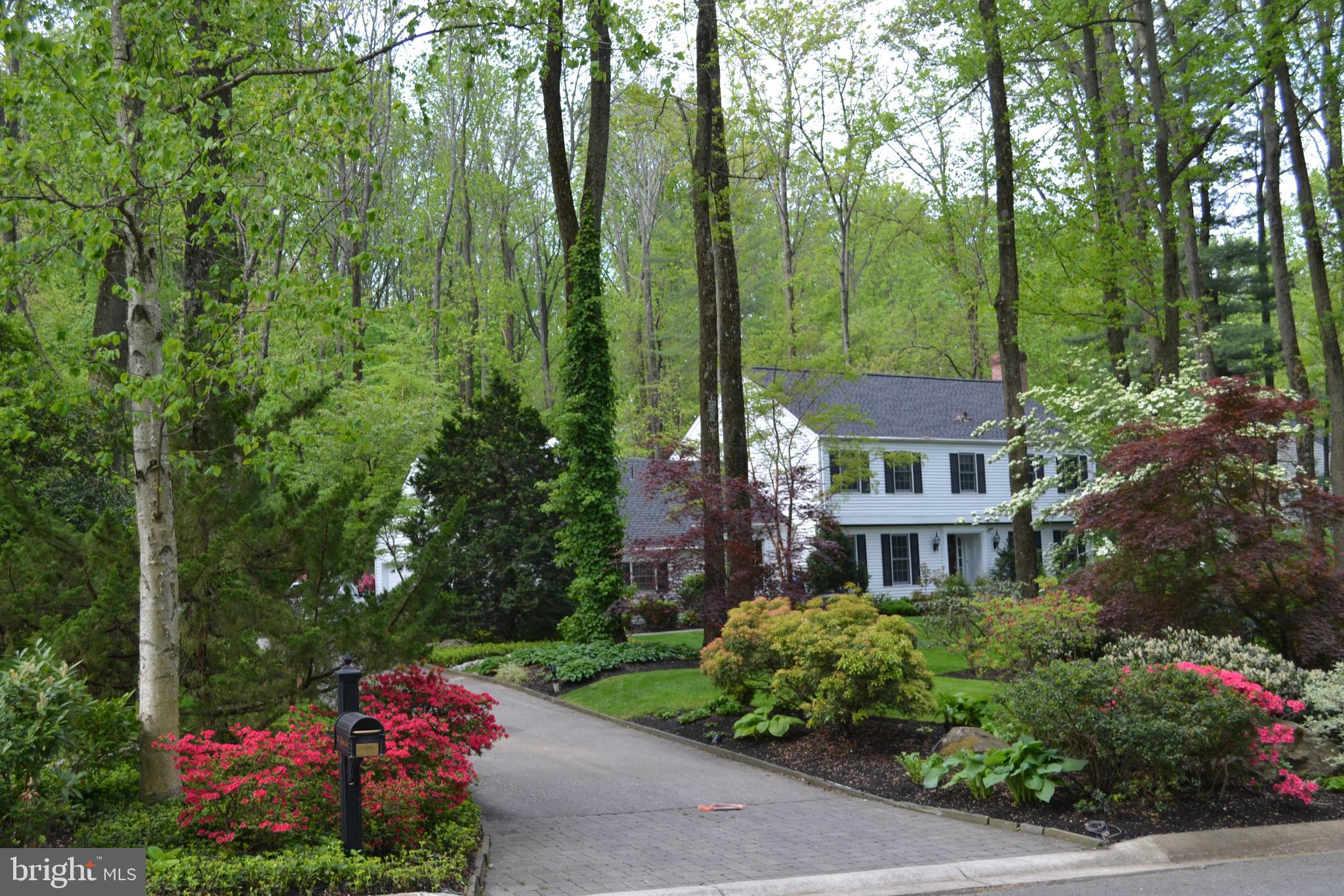 Welcome to 302 Jeffrey Lane, a stunning 4 bed, 3.5 bath home situated on a cul-de-sac street in sought after Newtown Square.  Arrive at the home and immediately notice the impeccable landscaping at every inch complete with irrigation system and exterior speaker system.  Enter the home into the bright foyer with hardwood floors that continue into the study/den on the left.  To the right of the foyer is the spacious formal living room with crown molding, built-in cabinetry, and a warm fireplace.  The heart of the home, the gorgeous kitchen, offers amazing upgrades including heated travertine floors, granite countertops, stone backsplash, double sink, island with warming drawer convection/microwave and integrated refrigerator drawers. There is also a new oven, and 5-burner cooktop, recessed lighting and breakfast complete with built-in hutch with integrated wine cooler.  Enjoy your morning coffee here or relax after a busy day!  Host dinner parties in the gracious dining room with another fireplace, integrated speakers, thr, hardwood floors, a pantry and wet bar with granite countertops.  Step outside through the Pella sliding door to the beautiful brick and stone patio where you can relax and enjoy the peaceful garden setting.  A laundry room, powder room and access to the 1-car heated garage completes the main level.  Upper level primary bedroom with integrated speakers features a walk-in closet, reach-in closet, recessed lighting and a spa-like en-suite with tiled shower, jetted tub, 2 sinks, and more!  Three additional bedrooms and a full bath with access from 2 rooms can also be found on the upper level.  Walk-up attic is floored and perfect for all of your storage needs.  Lastly, the basement has been finished to offer additional living space with an expansive family room with fireplace, entertainment area, full bath and another room currently serving as a sewing room.  This gorgeous home is ideally located close to local parks, golf clubs and within quick access to major roadways.  Do not miss out on this amazing opportunity!