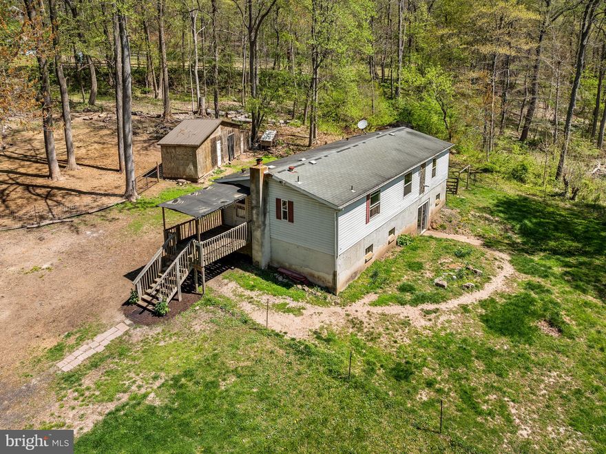 Welcome to your own private retreat, perfectly nestled against over 30 acres of serene woodland!

Located on 2.33 peaceful acres in the heart of scenic South Coventry Township, this well-maintained home offers the perfect blend of privacy, comfort, and country charm. Sitting on a permanent foundation, this 3-bedroom, 2-bathroom modular home is ready for its next loving owner.

Step inside to find a spacious kitchen with an abundance of cabinet and counter space, a propane stove, and a stainless steel refrigerator—ideal for home cooks and entertainers alike. The open dining area and cozy living room are bathed in natural light thanks to brand-new windows installed in 2023, and a pellet stove adds warmth and charm on cooler days.

The primary bedroom is a peaceful sanctuary featuring a large picture window overlooking your private wooded backdrop, a full en-suite bath with tub surround, and a generous walk-in closet. Two additional well-sized bedrooms share an updated hall bath with new flooring and a stylish new vanity.

Downstairs, the expansive basement includes a laundry area, mechanicals, a finished room perfect for a home office or hobby space, and a walk-out slider that leads directly to the backyard. Recent upgrades include all-new interior doors and a brand new well pump installed in 2025.

Outside, the property continues to impress with a large barn that features running water, a sectioned run-in area for animals, and a dedicated chicken coop. You'll also find an additional shed and a second chicken coop—ideal for those ready to embrace homesteading or enjoy a more self-sufficient lifestyle.

Whether you're looking to unwind in nature, raise animals, or simply enjoy the peace and beauty of your surroundings, this home offers something truly special. Come experience the breathtaking views and discover the possibilities! 
Pics will be uploaded on 4/23. Showings begin 4/24