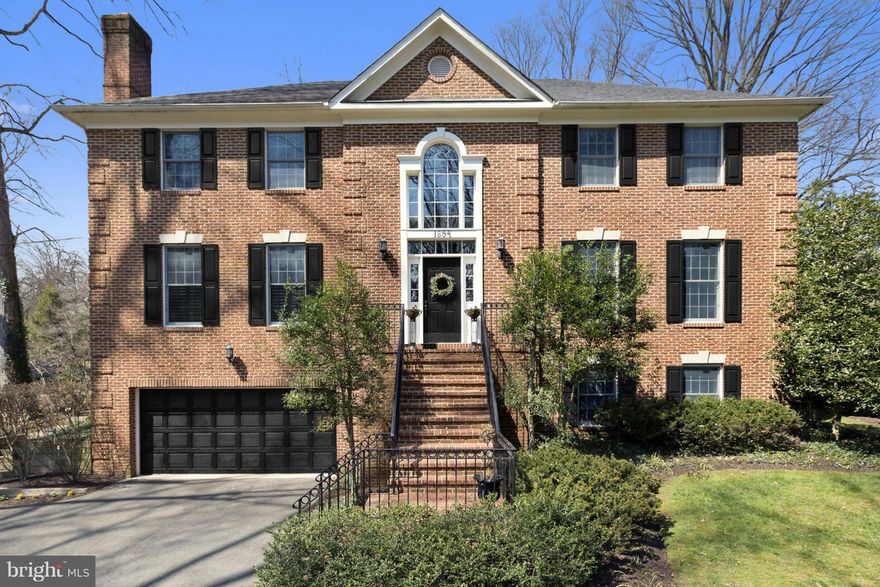 Handsome all brick colonial stately sited on half acre lot with scenic vistas from every room * Flowing floor plan and rich architectural features including 10 foot ceilings * Four fireplaces * Gourmet kitchen with stainless steel Bosch appliances * Family Room opens to kitchen * Breakfast Nook with French Doors to backyard * Luxury Master Suite with new bath * Oversized garage can fit 4 cars *