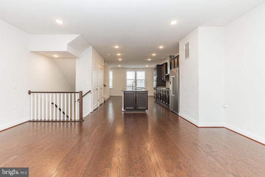 Spacious 4-level townhome in the MetroPark at Arrowbrook. This townhome features 4 bedrooms, 4 full bathrooms, and 1 half bath with a large kitchen and living room area, 2 car rear entry garage with an EV charger, and a rooftop balcony. Large master suite with 2 walk-in closets. The ground-level bedroom has its own full bath. 4th-floor loft walks out to lovely rooftop views. The roomy kitchen on the main level has upgrades galore, granite countertops, stainless steel appliances, and hardwood floors! Walking distance to Arrowbrook Centre Park which features sports fields, tennis courts, and a playground. Close to metro bus stops, fine dining, shops, Dulles Airport, and toll road. Sorry no pets.  In unit washer/dryer. Application Fee: $60/person. Don’t wait! this home won’t last!