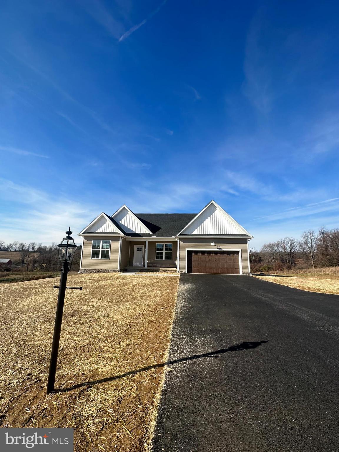 Move in ready! This home is a rare find on a huge lot, with a beautiful view. Welcome to Steeple Chase, a quaint community tucked into the countryside with beautiful views of your large private lot, yet close to all your local necessities. The Yorktowne Rancher features 1,950 sq ft of living space. This home includes 9' ceilings, Luxury Vinyl flooring throughout the main living space, oversized staggered kitchen cabinets, large windows, and additional trim throughout. The primary bedroom boasts a cathedral ceiling and fan, with a large walk in closet. The primary bathroom is luxury with a tile shower and separate tub, dual vanity and upgraded flooring. The Kitchen is bright and open with an oversized island, quartz counters and eat in dining area. Off of the kitchen, the highlight of the Great Room is a beautiful 10' tray ceiling! Improve your lifestyle with a short commute to major cities and just a short drive to great local restaurants, colleges, and hospitals. Spacious country living with a modern, luxurious feel perfectly describes this community. This community is a place where residents can enjoy the beauty of the outdoors and a convenient location for commuting.