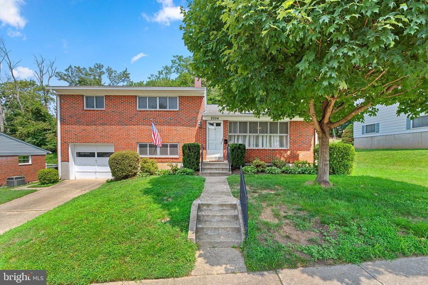 Tucked away in the Rollingwood neighborhood of Catonsville, this spacious split-level home features 3 bedrooms, 2.5 bathrooms, 1698 square feet over four levels, an attached garage, and an attractive price that opens the door to a compelling opportunity! Upon entering, the main level opens up to an inviting living space appointed with newly refinished hardwood floors. The large, sunny living room effortlessly leads into the dining area, creating a wonderful open space. The dining area adjoins the kitchen, featuring classic wood cabinets and ample storage. Ascending to the upper level, you will find three generously sized bedrooms, all featuring newly refinished hardwood flooring. The primary suite includes two spacious closets and an attached full bathroom. Two additional well-sized bedrooms, a large linen closet, and a second full bathroom complete the upper level. The first lower level reveals a cozy family room, complete with new flooring, built-in shelving, and walkout access to the rear patio and yard. The first lower level also offers a large laundry room, powder room, and access to the oversized attached garage. Just outside the family room lies a large paved patio and a meticulously maintained lawn that backs to trees, creating your own private oasis. The fourth level of this split-level home provides additional storage and plenty of potential for customization. The opportunities are endless to create a space that suits your needs, whether it be a home office, gym, playroom, or craft area. Nestled in the heart of the Rollingwood neighborhood, this stand-out location is just a stone's throw away from Rollingwood Pool, perfect for cooling off during the summer months with an additional membership. For outdoor enthusiasts, the nearby Patapsco State Park Hilton Area provides an opportunity to explore trails, picnic areas, and of course the tire park! Enjoy shopping and dining at the locally owned establishments along Catonsville’s Frederick Road, or head over to enjoy the restaurants, boutiques, and antiques of Old Ellicott City, with both destinations just a short drive away. The home's convenient location also makes commuting a breeze. With easy access to highways 695, 195, 95, 295, and 29, getting to Baltimore, DC, or surrounding areas is straightforward and stress-free. With a warm, inviting feel, a versatile layout, the location you’ve been waiting for, and the price you can’t resist, this casually comfortable Catonsville home is ready for you to make it your very own!
