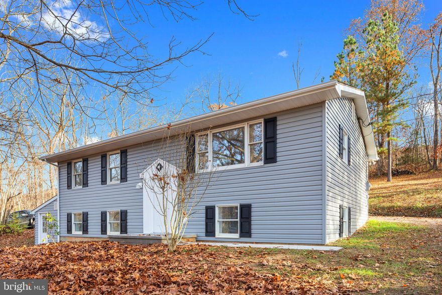 "Meet You At Upper Patterson Creek" This 5-bedroom, 2 full bath split foyer home sits on 2.008 acres and has been beautifully renovated! Freshly painted and ready for you to move right in! Spacious kitchen with new counters, new cabinets, new vinyl flooring, new wall heater for additional heat, stainless steel appliances and a convenient back entrance so you don't have to carry your groceries far! Main level has 3 bedrooms with new carpet and a full bathroom with a new vanity, toilet, new vinyl flooring and light fixture. Family room and hallway on main level has new carpet as well. Finished basement with new carpet, 2 bedrooms, 1 full bath, den area and 2 rooms that would make great offices. Attached storage area on house with an outside entrance, fresh gravel/moisture barrier and freshly painted. New vinyl siding, new gutters/downspouts, new soffit and new fascia. New pressure tank, new switches/outlet covers, new hot water heater, new utility sink and new water filter! New HVAC system upstairs!