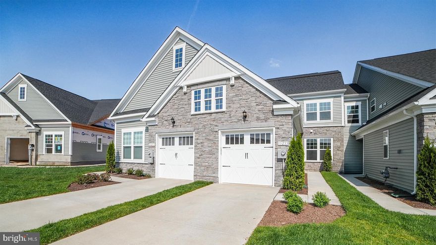 Move in come spring to this beautiful Blue Ridge. Light filled living area and kitchen featuring a chef's kitchen with stainless hood. Quartz countertops and LVP flooring throughout this gorgeous main level living home.  Upon entering the Blue Ridge, you will be greeted by LVP flooring, and a spacious foyer that leads to a powder room and a conveniently placed laundry room. The attached 1-car garage provides protection from the elements and offers additional storage space for your belongings. After a long day, retreat to the main level primary suite, a spacious getaway complete with a large walk-in closet and ensuite bath with a dual vanity and seated shower. On the second level, you will discover a secondary bedroom and full bath, providing you with the flexibility needed to accommodate guests.