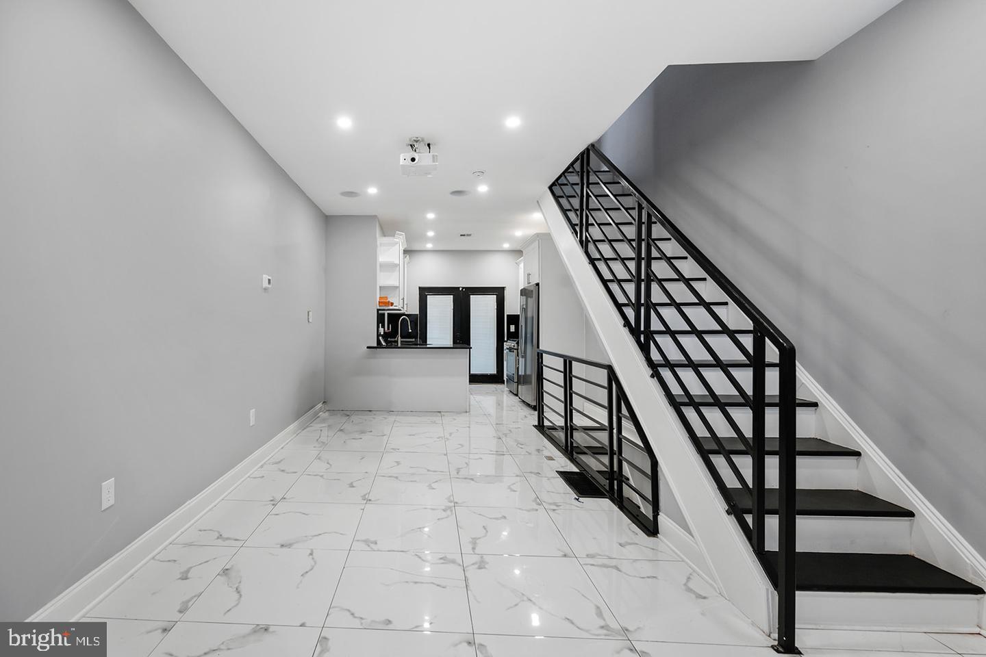 Welcome home to luxury and modern living in this beautifully renovated house nestled in the heart of Brewerytown. As you step inside, you'll be greeted by an open living, dining, and kitchen area with glass doors leading to the backyard, flooded with natural light and featuring high ceilings. The modern kitchen boasts custom cabinets, sleek stainless steel appliances, and stunning stone countertops.
The second floor offers two generously sized bedrooms with abundant closet space and a full bathroom. Ascend to the third floor to find an entire private primary suite, complete with a spa-like bathroom featuring a soaking tub, a massive glass-enclosed shower with two shower heads, and floor-to-ceiling tile. Head up to your private roof deck to enjoy sweeping skyline views.
The finished basement provides ample space for an additional living area, workout room, or home office, along with a powder room and a full-size washer/dryer. This one-of-a-kind gem is not to be missed! Schedule your showing today.