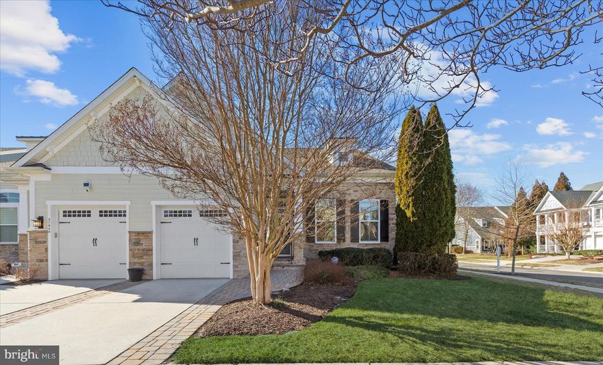 Location ! Location !!  Amenity rich Bayside community  - 31940 Dogwood Way, Selbyville, De - Welcome to a  lovely coastal Severn villa boasting 2800 sq ft, 4 bedrooms, 2 1/2 baths, located in the highly desirable Commons Neighborhood (the Sweet Spot of Bayside)   Perfectly positioned on a desirable corner lot and just moments from the Commons Neighborhood community pool,  pool parking, mailboxes, book exchange nook, summer beach shuttle stop. Enjoy open green space park like areas, tree lined streets, and a community garden. This home offers both convenience and an exceptional coastal lifestyle.
 
From the moment you step inside, the inviting living room makes a striking impression with its two-story vaulted ceiling, creating an open and airy atmosphere filled with natural light. Rich hardwood flooring flows throughout the main living areas, complemented by high ceilings, detailed crown molding, and elegant wainscoting that add warmth and character. The dining room is beautifully appointed with deep crown molding and wainscoting, making it an ideal space for hosting special occasions and memorable gatherings.
 
The kitchen is thoughtfully designed for both everyday living and entertaining, featuring elegant granite countertops, a center island perfect for casual meals, additional table space, and a pantry for storage. Culinary highlights include double wall ovens, a French-door stainless steel refrigerator, a five-burner gas cooktop, a stylish backsplash, and a tray ceiling that adds architectural interest.
 
The living space flows seamlessly into a bright and welcoming sunroom with a cozy gas fireplace, creating a perfect spot to relax year-round. An atrium door from the Sunroom leads to a spacious screened-in porch with direct access to the paver patio, ideal for enjoying coastal breezes and outdoor dining.
 
The main-level primary suite offers a peaceful retreat, complete with a tray ceiling, walk-in closet, with an en suite bath featuring dual-sink vanities, a soaking tub, and a separate stall shower. Upstairs, a generous  loft serves as a central hub to three additional bedrooms, 1 storage room  and a full bath, providing ample space for guests or family.
 
Enjoy the Bayside lifestyle - an unmatched array of amenities. Bayside is also home to the coveted Jack Nicklaus Golf Course , Signatures Restaurant, and 38 Degrees at The Point. Enjoy water access for kayaking, both indoor and outdoor swimming pools, a community fitness center, variety of water aerobics, exercise classes, and a vibrant lifestyle. Enjoy Bayside Institute classes, tennis, pickleball,  basketball and an entertainment scene at the Freeman Arts Pavilion Stage with ongoing concerts and events. With everything you need just minutes from the warm sands of both Delaware and Maryland beaches, this coastal villa is more than just a home, it’s an opportunity to embrace the beauty, energy, and exceptional lifestyle that Bayside has to offer. Bayside is located only 4 miles to Fenwick Island & Ocean City, MD.