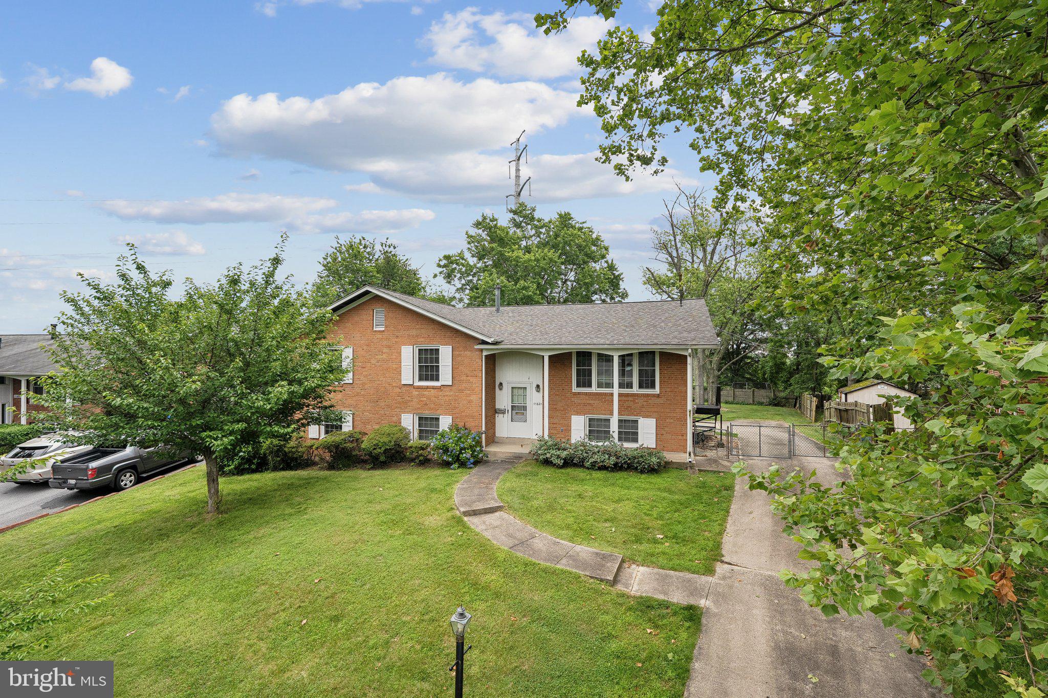 Second opportunity- buyers had cold! 2 blocks from Churchill High School, this house is truly a unique opportunity. Situated on almost half an acre not backing to other homes, this is a TRUE 6 bedroom 3 Full bath home. The main level is entirely field finished hardwood floors. 4 bedrooms, 2 full baths, full size family/dining rooms, and a galley kitchen w/ table space and side entrance. The basement includes a kitchenette with a gas stove, utility room with washer and dryer, 2 other bedrooms, another family room, and a full bath. The driveway wraps around the house to a parking pad the enters directly into basement setup. Perfect setup to rent basement or additional occupants. Roof is less than 2 years old, windows have been replaced. Kitchen has been updated, bathrooms wait for new owner's remodel. Completely livable yet ready for value added updates. Also walkable to Herbert Hoover Middle, Beverly Farms Elementary, and St. Andrew's Episcopal School. Minutes to 270, 495, and parks and recreation in all directions