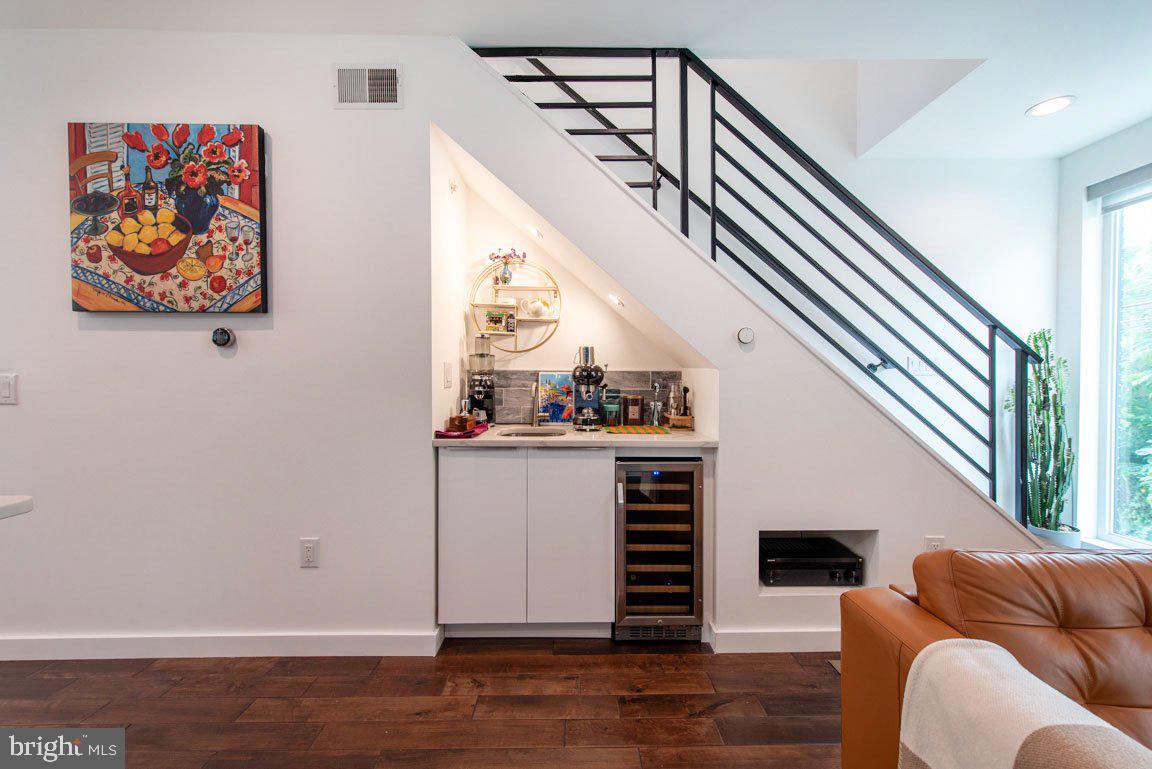 Don't miss this 3 bed, 3.5 bath SINGLE FAMILY Townhome with ATTACHED GARAGE and ROOF DECK. Walk in to 3 illuminated niches that flow down a hall that has coat closet and access to Garage. AMAZING floor to ceiling windows line the stairwell FLOODING THE KITCHEN WITH SUNLIGHT. This floor boasts a MODERN KITCHEN with lush contemporary cabinets, CALCUTTA QUARTZ COUNTERS, a MARBLE TILE backsplash, NEW stove cook top with range hood, and all STAINLESS APPLIANCES. A perfectly placed Powder Room is off the Kitchen The COCKTAIL BAR AND ULTRA-LIT FIREPLACE surround the Living Room with a recessed wall for seamless control of the SPEAKERS THROUGH THE HOUSE. 2 well-appointed bedrooms and a fully tiled bathroom are up a level, with the top floor housing an INCREDIBLE MASTER SUITE! Boasting an enviable MASTER BATH that includes HEATED MARBLE FLOORS, WALK IN SHOWER with fully digitized shower, custom marble tile throughout, and a floating a double sink, you'll never want to leave. The top-of-the-line Kohler Digital Diverter, Wi-Fi/Bluetooth enabled, offers full control over temperature, pressure, and music/video playback. The suite also includes his and her closets and a Juliet balcony.
And don't forget the PRIVATE ROOFTOP OASIS, offering BREATHTAKING VIEWS OF CITY HALL, THE RIVER and more. Continuing the abundance, the BASEMENT INCLUDES FAMILY ROOM or another bedroom if you like, and an INCREDIBLE FULL BATH with marble tiled shower and floating vanity, laundry and utility closet with Commercial grade hot water tank that never runs out of hot water. The sheltered Front Entry has a Nest doorbell with keyless entry, 3 exterior cameras with night vision. 3/4" hardwood flooring throughout. The GARAGE, spacious enough for a large SUV, has interior access. And as if this weren't enough, the property comes with warranties ranging from 10 to 20 years. Plus, the tax abatement is still in effect.
Enjoy a quiet, friendly part of Philly where kids play outside, and well-lit sidewalks make getting to restaurants and grocery stores a joy. The Bus is close by. WHOLE FOODS, TARGET, PLAYGROUNDS, COFFEE BARS and more are right here. Plus, you can reach center city in 20 minutes by foot. Run, don't walk! This home is special.