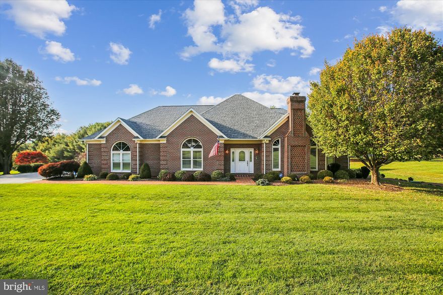 Fabulous, exceptionally maintained, 2-level brick home in the quiet and peaceful Shenandoah Golf Community.  Owners’ pride shows both inside and out, from the large yard and manicured gardens to the well maintained home features. This move-in ready, beautiful, airy home with cathedral ceilings offers true one-level living. The main floor features hardwood floor throughout the formal foyer, separate living and dining room, family room, and gourmet kitchen with breakfast nook. The large kitchen features stainless steel appliances, granite counter tops and cherry cabinetry. The family room has a gas fireplace, built in wet bar, and opens onto a 4 season room with plenty of light and a wood plank ceiling. A deck off the family room has stairwell to patio below. The large primary bedroom has 2 walk-in closets, a renovated bath with dual sinks, tile shower and walk-in tub.  A dedicated office, a second bedroom and full bath, a laundry room and 2 car garage with tile floor complete the level. The lower level has an additional family room with gas fireplace, 2 additional bedrooms and full bath, storage room/exercise room cedar closet and walk-out level to concrete patio and built-in gas grill.  2 Zoned HVAC System, Whole Home Generator, Central Vac System, Water Softener with UV System, ADT Security System, Storage shed, large backyard with fenced garden area, and many more extras and upgrades! Minutes from golfing, shopping, restaurants, downtown, I-66 and I-81. Comcast High Speed Internet.