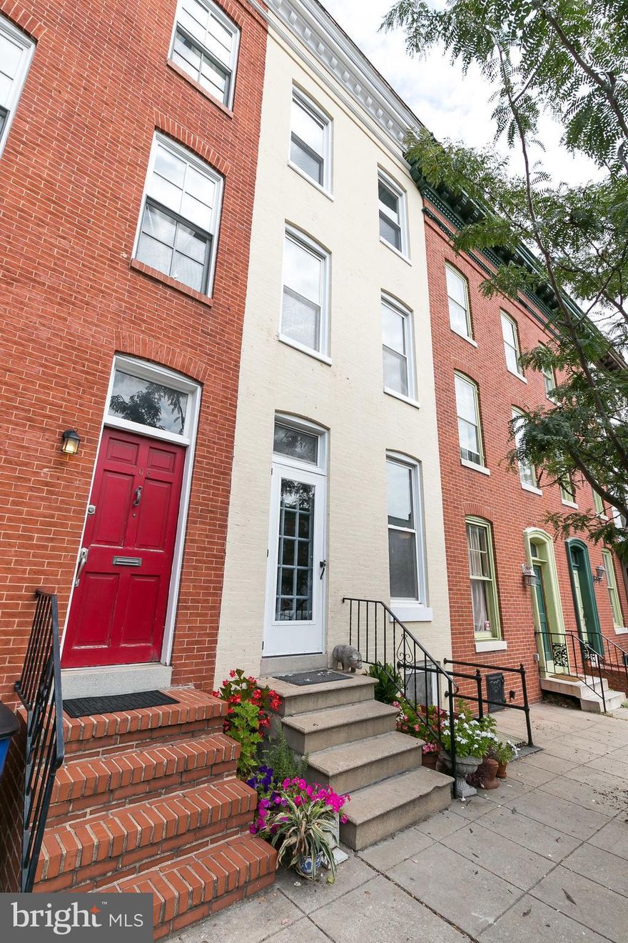 Beautifully restored home in Ridgely's Delight with gleaming original hardwood floors and trim!  9 and 1/2 foot ceilings.  A plethora of natural light fills this wonderful city oasis.  The bsmt has plenty of room for storage or a work shop.  There is a sunroom on the main floor and a 2nd family room on the 2nd floor.  This house is eligible for the Live Near Where you Work Grant.